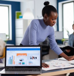 African entrepreneur of start up company reading charts